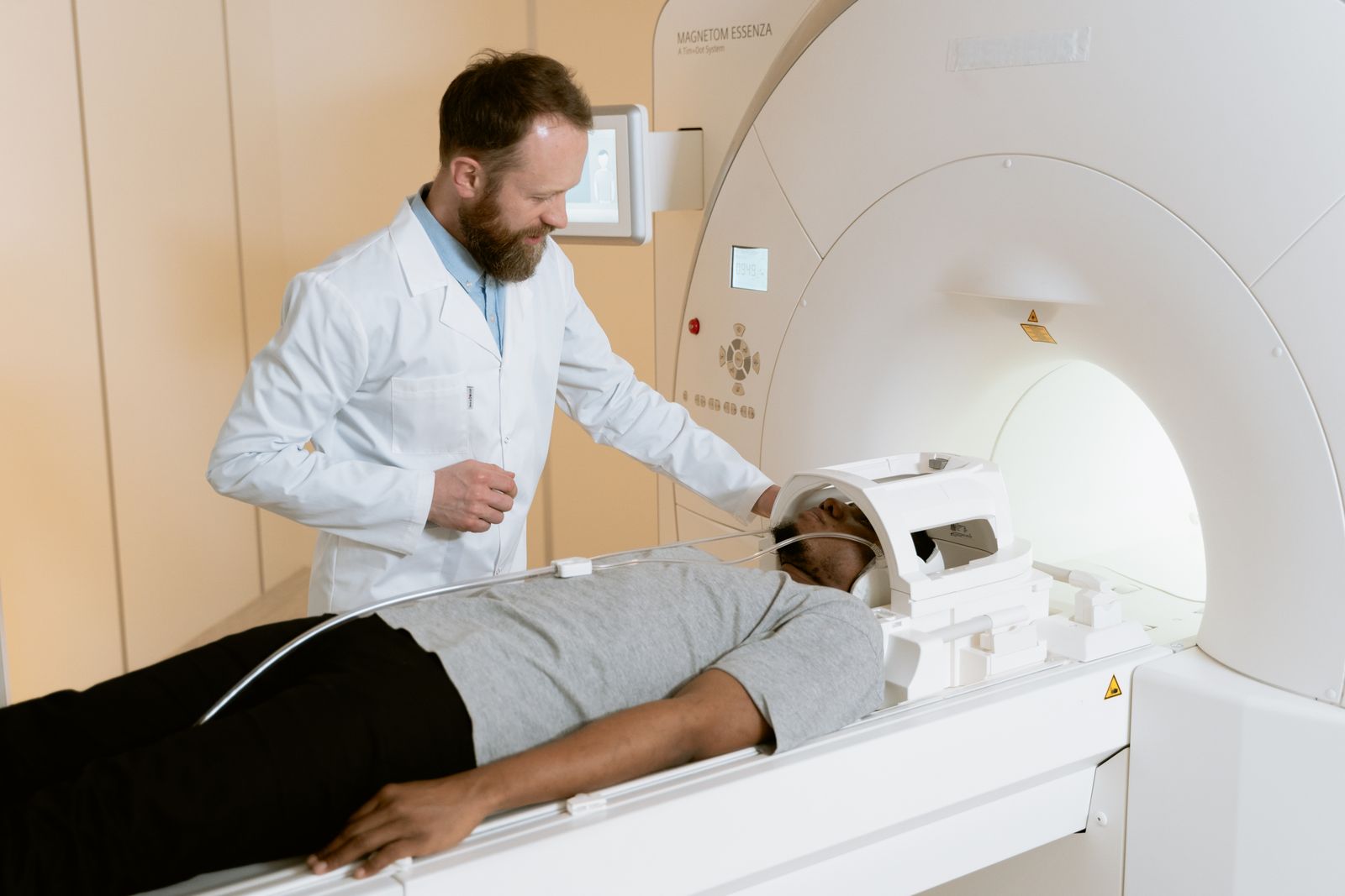 Radiologist positioning a patient for an MRI scan